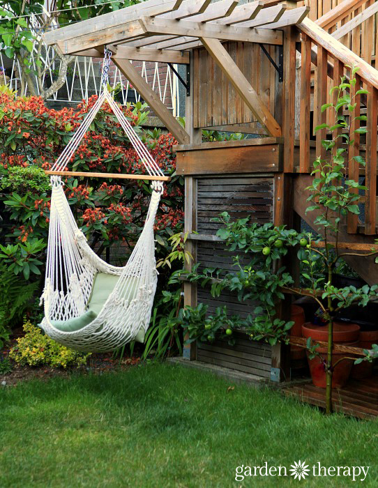 Garden Therapy Back Yard Play Garden Tour Apple espalier and hammock chair