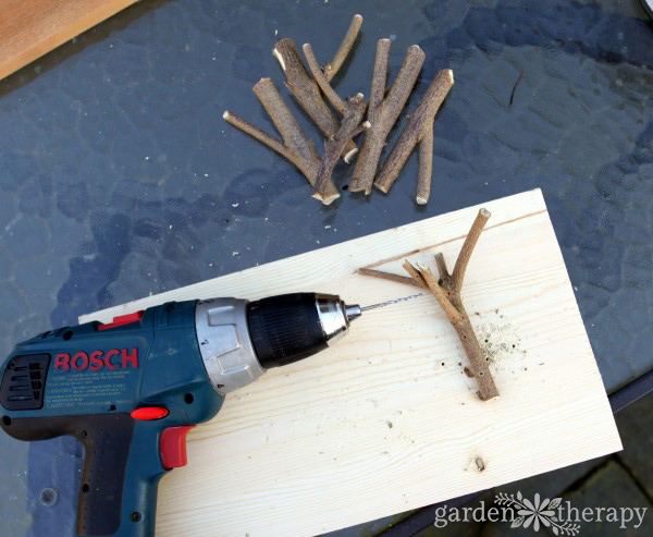 This inexpensive and easy weekend project shows you how to create a stylish branch coat rack with just some branches, paint, and a few tools.