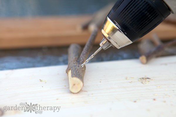 This inexpensive and easy weekend project shows you how to create a stylish branch coat rack with just some branches, paint, and a few tools.