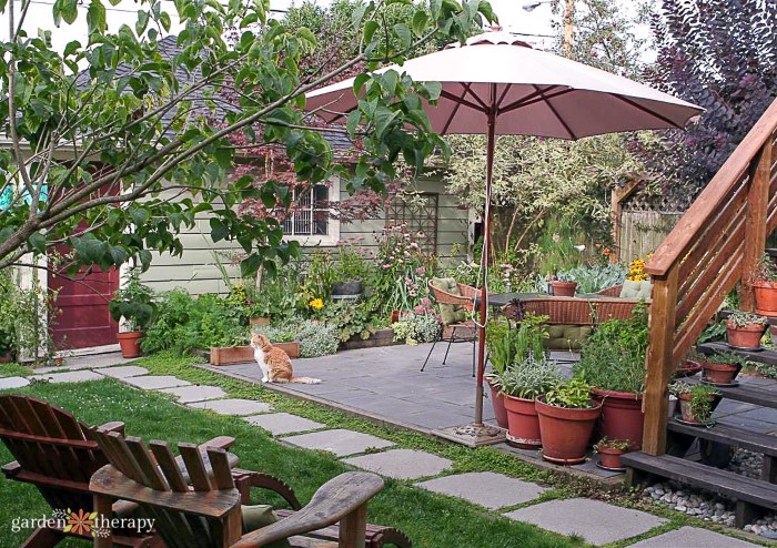 Beautiful garden patio with umbrella and potted plants