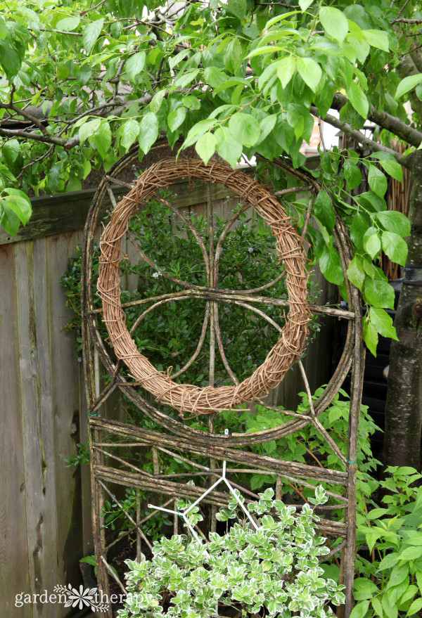 Bentwood Grapevine Wreath hanging as garden art
