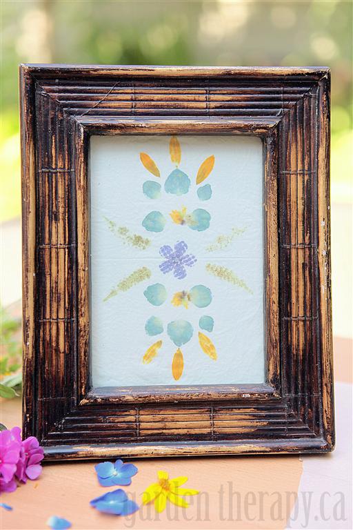 flower pounding on fabric in a frame