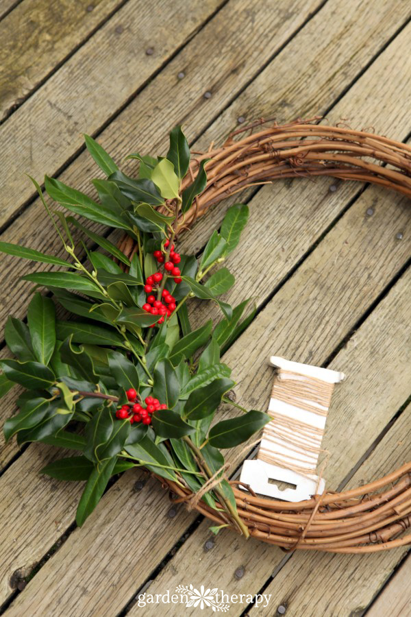 fresh holly wreath dotted with bright red berries