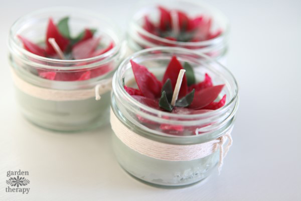 These poinsettia candles make for a fun handmade Christmas project. They are made with beeswax and soy wax and scented with festive essential oils.