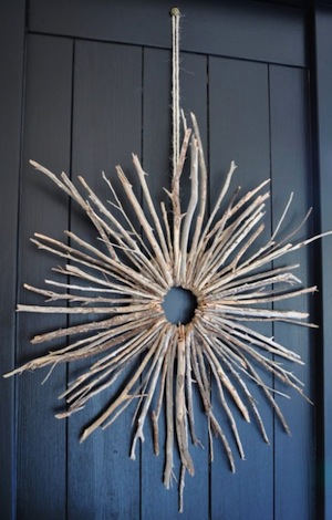 Round twig wreath on a black door