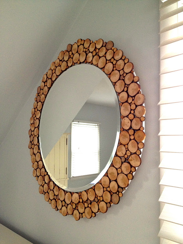 mirror with wood slices around the circumference
