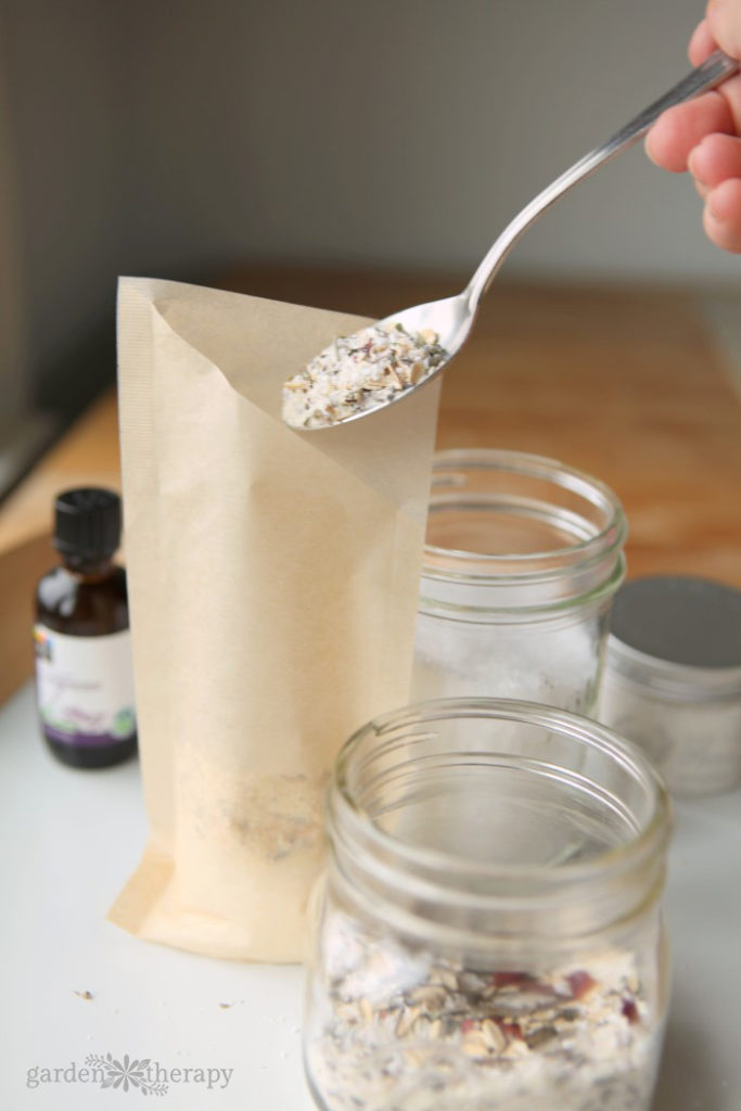adding dried botanicals to a filtered bag for tea tub soak