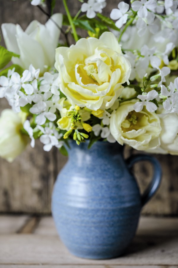 white flowers in a blue jug