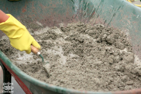 mixing repair concrete in a wheelbarrow