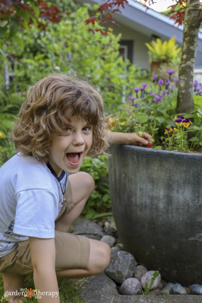 kid happy in the garden