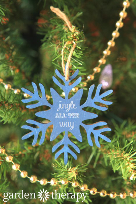 DIY ornament with a Wooden snowflake painted blue 