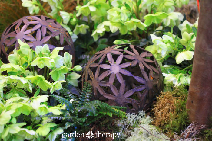 Rusty Floral Garden Balls from the Blue Greenhouse Seaside Garden Design Feature