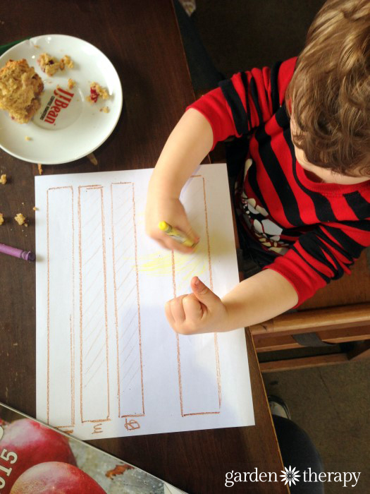 Child designing a map for gardening