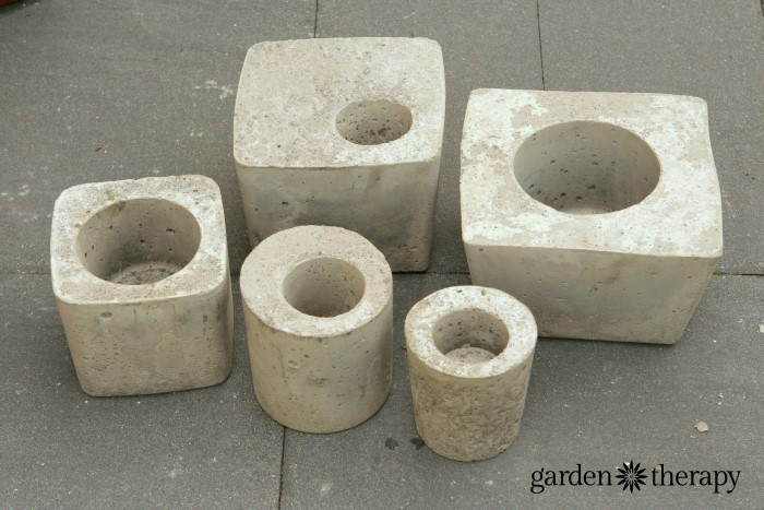 Large and small cement planters made from easy DIY concrete molds