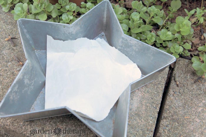 Line the planter with paper