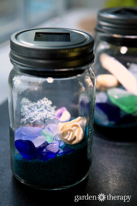 These DIY Beach Mason Jar Solar Lights really cast a glow reflected off the beach glass