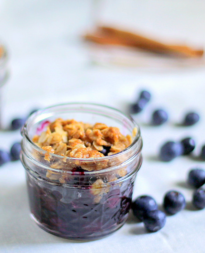 Mini blueberry crisp baked in mason jars