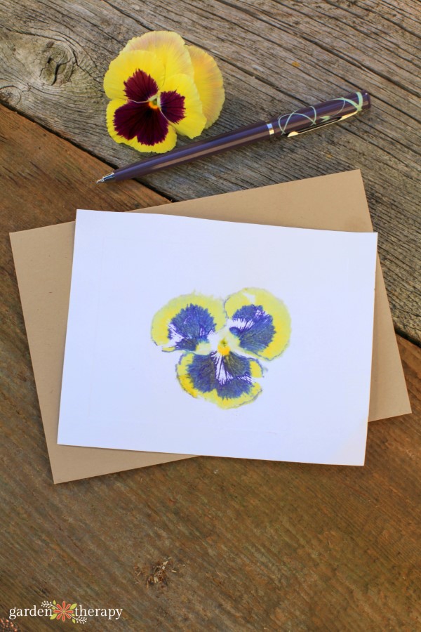 hammered flower print card with a pansy