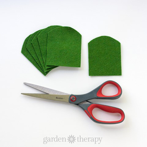 Cutting out a felt cactus from green felt