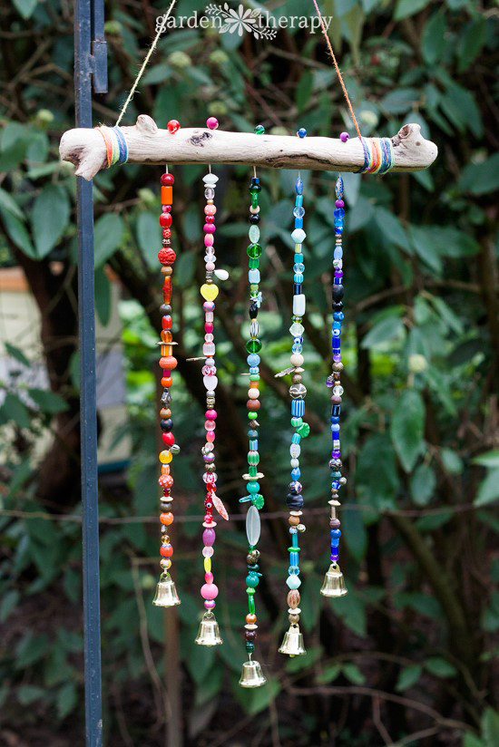 things to make with branches from a Christmas tree include this rainbow beaded windchime 