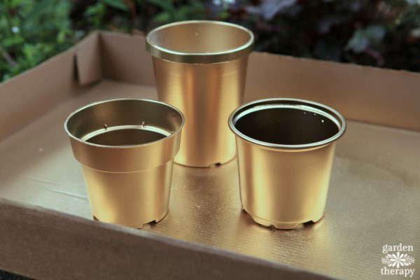 Gold painted plastic pots