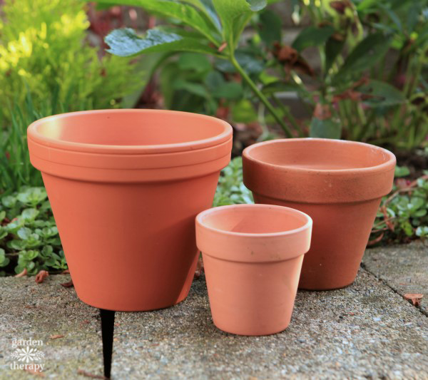 empty terracotta pots of various sizes outside