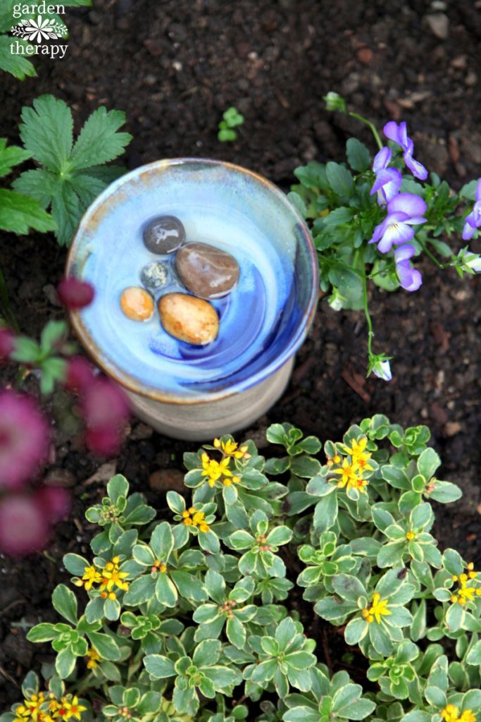 Bee bath filled with rocks