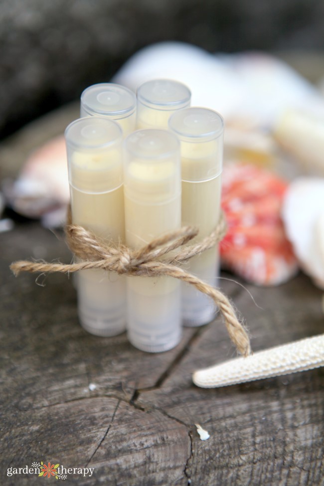 Homemade Sunscreen lip balm tubes tied together with twine