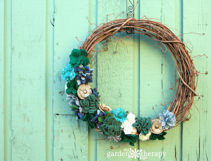 Warm up to autumn this year with a cozy fall wreath made from thrifted sweaters. This felted succulent wreath is a unique design that is easy to make.