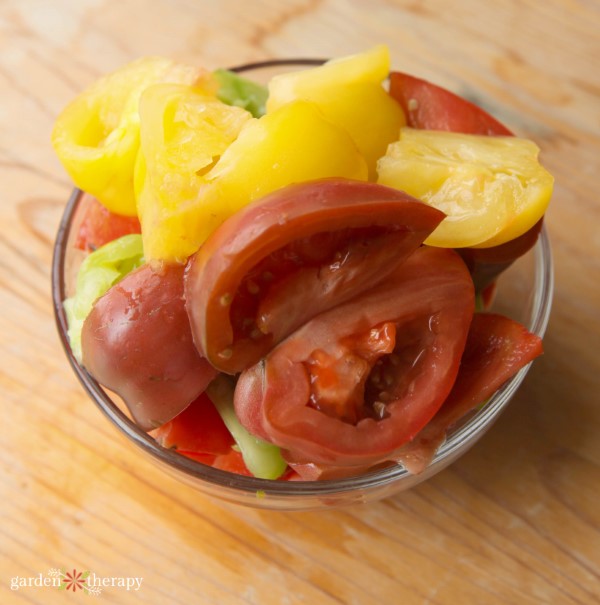 tomatoes cut into sections for seed saving