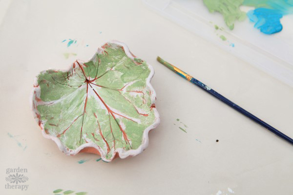 Painting a clay bowl