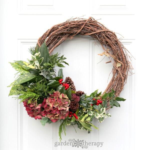 beautiful fresh wreath with a variety of greenery cut from the garden 