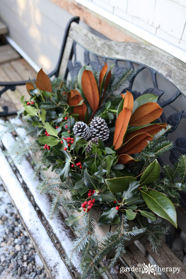 Create a festive holiday window box with a wood planter and some fresh greenery. You will quickly have a long lasting planter to freshen up the outdoors.