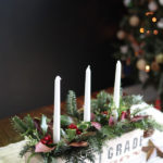 A rustic and natural Christmas candle centerpiece planter can be used as table decor, fireplace mantle, or even outdoors on the porch. See the DIY.