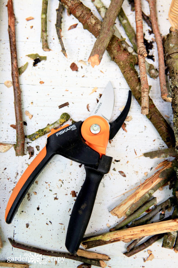 Fiskars pruners for bug hotel fence art