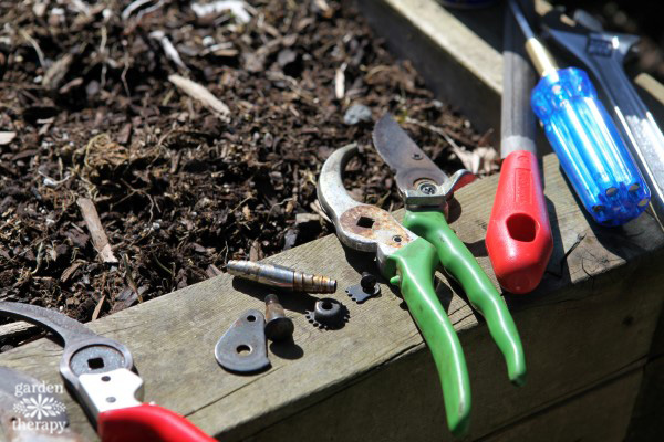 parts of pruners sitting in the sun in the garden