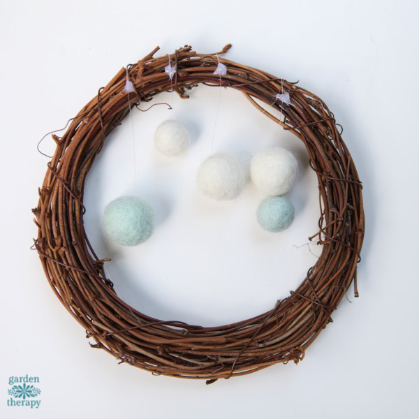 Make a whimsical winterscape on a wreath in a few simple steps.