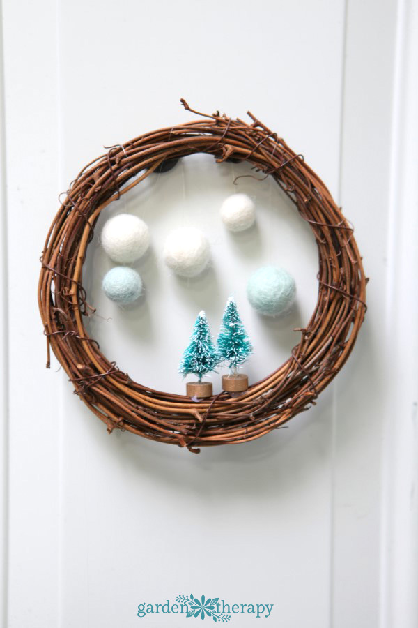 Make a whimsical winterscape on a wreath in a few simple steps.