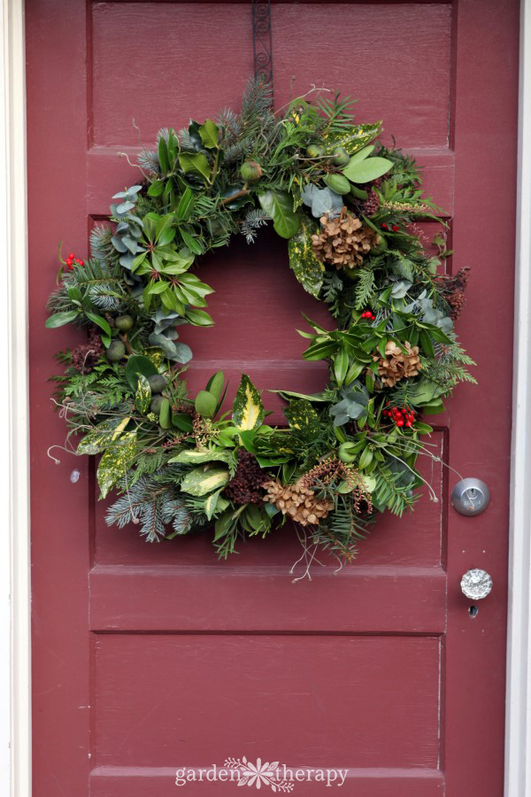 DIY Christmas wreath on a mulberry coloured door