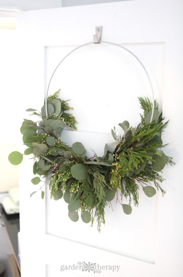 cedar and eucalyptus on a wreath being used as Christmas greenery