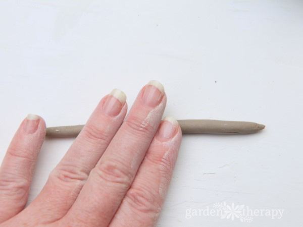 roll out clay into snake shapes for the stems