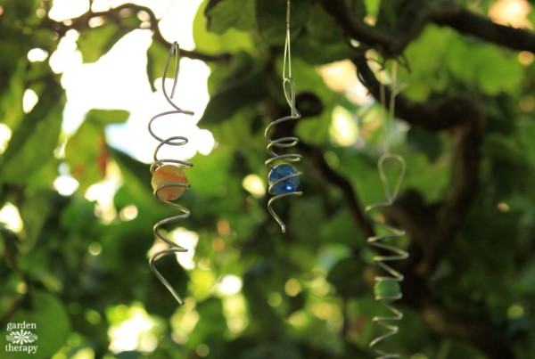 DIY wind spinners hanging in the garden