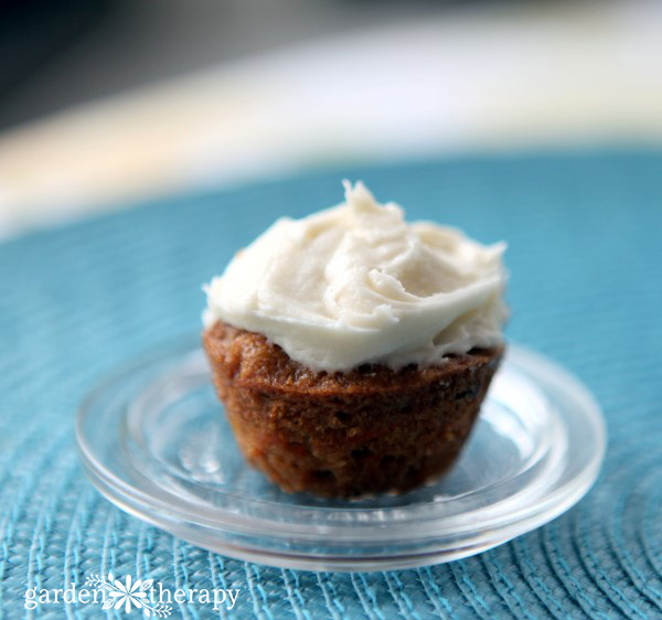 Mini whole wheat carrot cake cupcake topped with cream cheese frosting