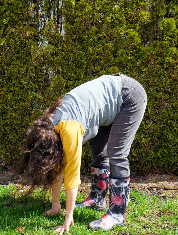 touch the earth: a stretch to prevent stiffness from gardening