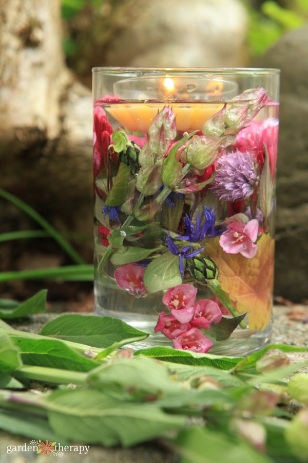 floating candle with flowers in a vase