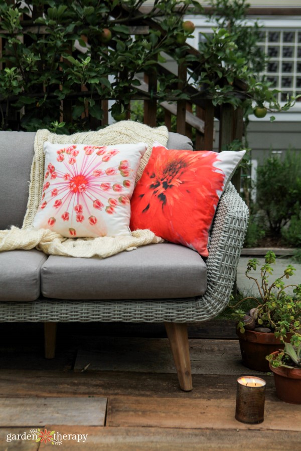 outdoor sofa with pillows and blanket