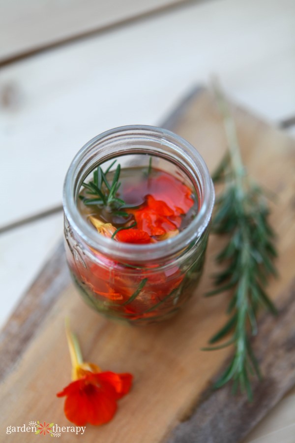 nastirtium and rosemary vinegar infusing in a jar