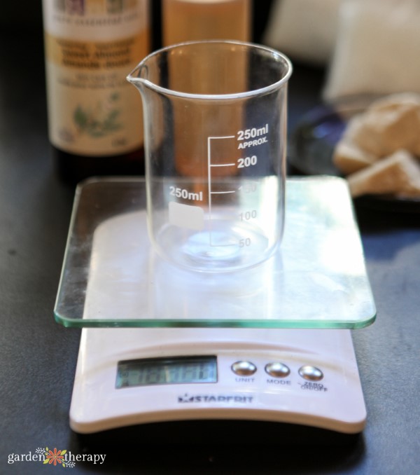 weighing lotion ingredients in a beaker