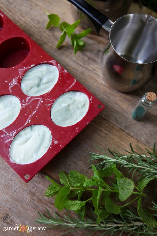 rosemary spearmint soap setting in a mold