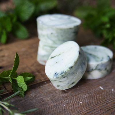 A stack of homemade rosemary spearmint soap bars